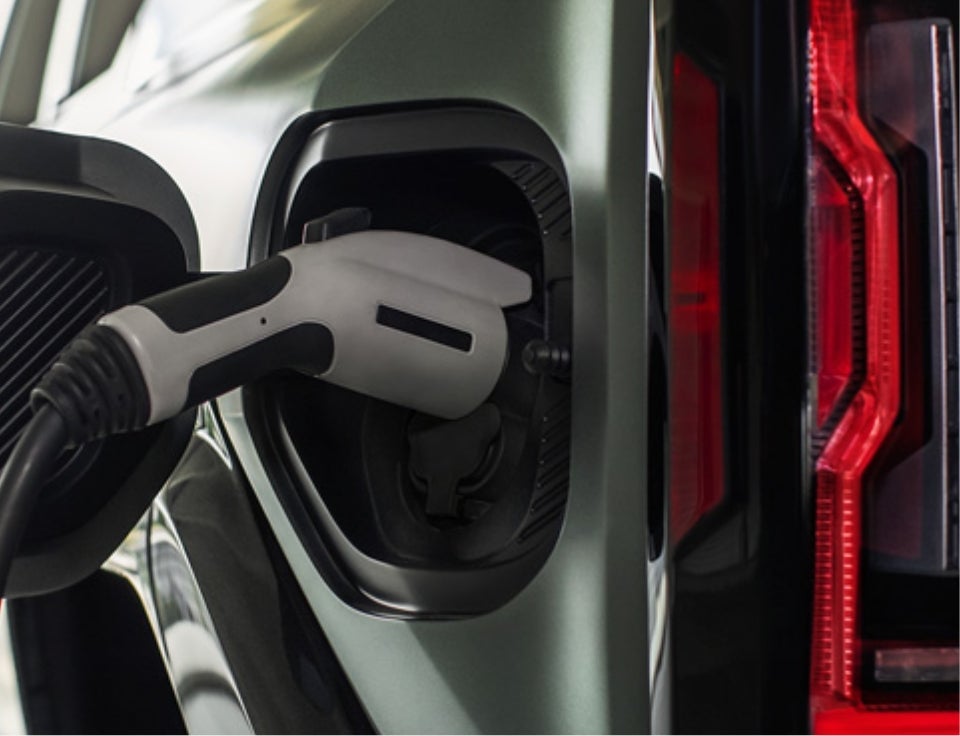 Close up of charging port with charger plugged in on a GMC Hummer EV SUV - DIPRIZIO GMC TRUCKS, INC. in Middleton NH
